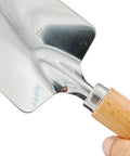 Close-up of Built To Last Stainless Steel Garden Shovel with ergonomic wooden handle, showing blade and handle attachment.