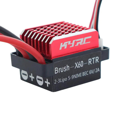 Close-up of 60A Brushed ESC for 1/10 RC Cars and Tanks, featuring red aluminum cooling system and cables, 6V 2A BEC