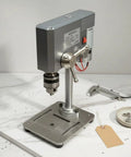 Mycense Mini Drill Press Bench Machine With 0.6-6mm Clamping Range Ideal For Delicate Bits And Detail Projects positioned on a workspace.