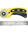 45mm Wavy Rotary Cutter With 10 Piece Pinking Circular Refill Blades For Fabric Paper Leather Crafts Quilting Patchwork Sewing Tool For DIY Makers SKS 7 Stainless Durable Cuts Through 6 Plus Layers, displayed on a flat surface next to a ruler.