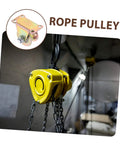 Close-up of yellow industrial rope pulley system in use, focus on chain and hook mechanism for lifting machinery.