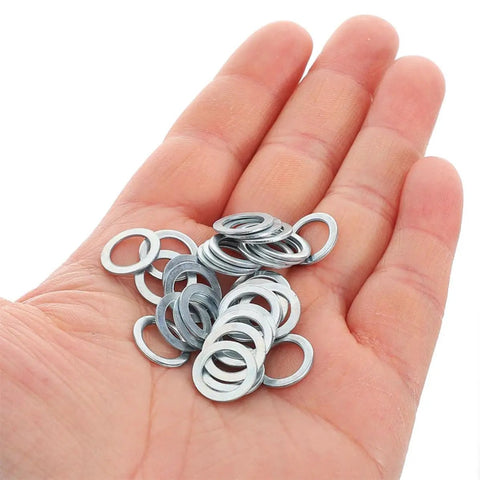 200 Piece Aluminum Flat Washer Kit For Skateboard Hardware Versatile Spacers For Longboards And Skateboards Replacement And Repair Easy Install For Any Skater, silver aluminum washers in hand