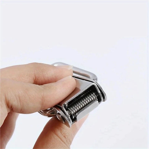 Close-up of a hand holding a latch from 8 Piece Spring Rod Latch Clip Set For Toolbox And Leather Box Doors, Easy Quick Lock Toggle Catch For Cabinets, Secure Home And Shop Storage, Heavy Duty Safe Closure And Smooth Operation.