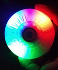 Close-up of the eight pack inline skate wheels with bearings ABEC 9, light up 68mm, 90A PU, colorful flashing in darkness.