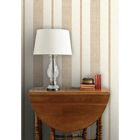 Rich Cream And Modern Gold Vinyl Wallcovering Boasts Subtle Leather Texture For Commercial Grade Heavy Duty Wear backdrop with lamp and decor.