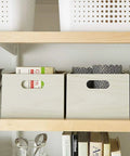 Wooden storage boxes on a shelf supported by Premium Maple Edge Banding Roll Thirteen Sixteenths Inch by Two Hundred Fifty Foot Pre Glued Iron On Wood Veneer Tape With Hot Melt Adhesive Smooth Sanded Finish For Furniture DIY Projects Made In USA.