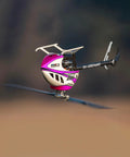 M2 V3 Sport BNF RC Helicopter For Adults With OFS3 Plus Flight Controller in flight, pink body, outdoors