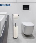 Free Standing Black Toilet Paper Holder Stand With Reserve Storage Space Saving Bathroom Roll Holder in modern bathroom setting.