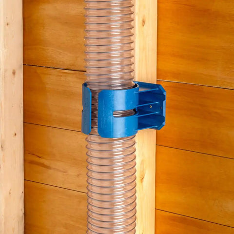 Premium Rockler Dust Right 4 Inch Hose Cradles mounted on a wall holding clear vinyl hose for dust collection.