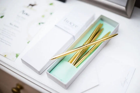 Premium Ballpoint Pen Set Of 6 In Glossy White Gift Box With Gold And Black Ink For Women And Men displayed open on table
