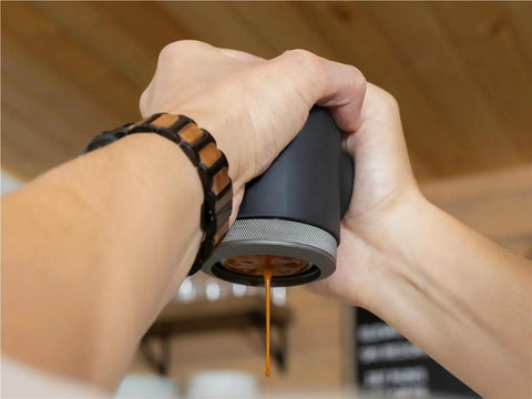 Person using Picopresso Portable Espresso Maker With 18 Bar Pressure For Quick Pulls On The Go Ultra Compact Coffee Machine