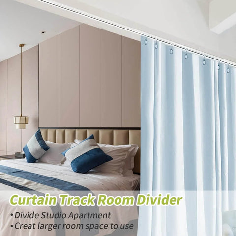 Heavy Duty Aluminum Ceiling Curtain Track System, 3 Pack of 3 Ft Rails shown dividing a bedroom and blocking light.