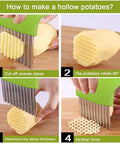 Front view of a green handheld crinkle cutter with stainless steel blades slicing a potato into wavy strips.