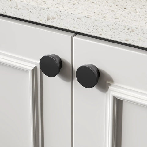 18 Pack Black Cabinet Knobs Zinc Alloy Round Drawer Knob 1-5/8 Inch installed on white kitchen cabinet doors