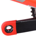 Red MTB Crank Arm Boot Silicone Sleeve Protector installed on black bike crank arm for mountain bikes and trails