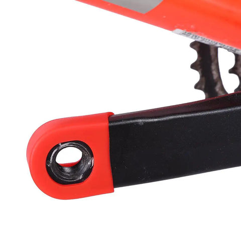 Red MTB Crank Arm Boot Silicone Sleeve Protector installed on black bike crank arm for mountain bikes and trails