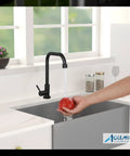 Black Cold Only Water Kitchen Faucet With Single Lever Slick Commercial Bar Tap in use washing a tomato