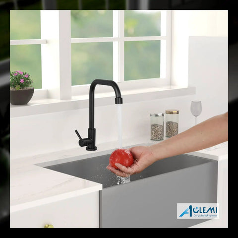 Black Cold Only Water Kitchen Faucet With Single Lever Slick Commercial Bar Tap in use washing a tomato