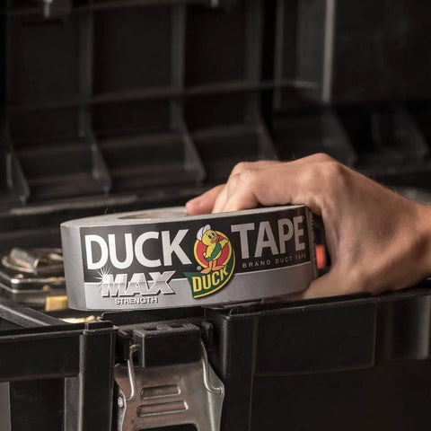 Person holding Max Strength Duct Tape For Heavy Duty Fixes Workhorse 1.88 Inch By 45 Yards Weatherproof Silver Tape in toolbox