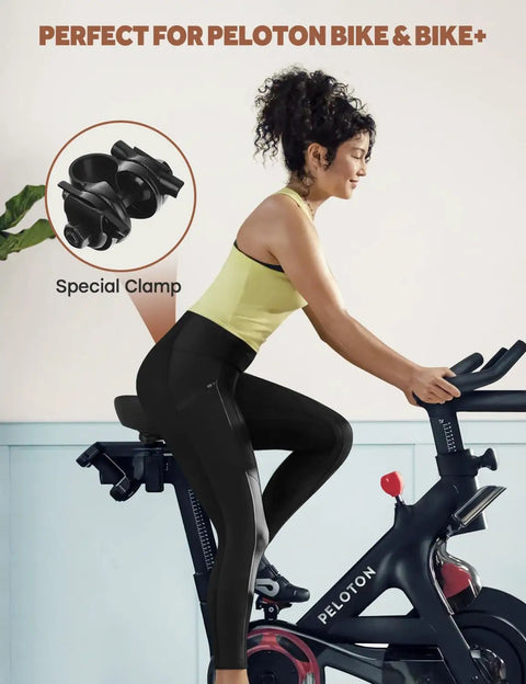 Woman on Peloton with Extra Wide Comfort Bike Seat For Men And Women Pain Free Rides With Ergonomic Design and Ventilation Holes