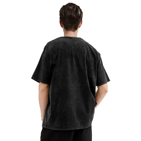 Back view of person wearing a black washed T-shirt with short sleeves and loose fit, casual style.
