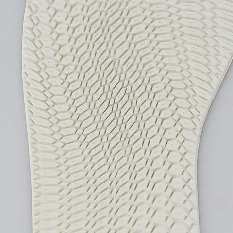 Close-up of textured surface of cushioned white sole from DIY Rubber Sole Replacement Kit For Shoes, Easy Install With Low Arch Comfort