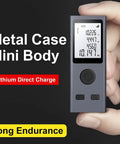 Heavy Duty Laser Rangefinder With Hella Accurate 98 Foot Digital Measurement Tool USB Rechargeable Battery HD Backlit Panel For Contractors And Side Hustlers in a metal case, held in hand.
