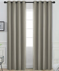 Room Darkening Blackout Curtains 52 By 84 Inches Taupe Two Panels With Grommets installed in a bedroom for light blocking.