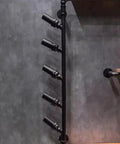 Straight Up Industrial Wine Rack Built From Heavy Duty Iron Pipes Countertop Or Wall Mount Organizer showcasing five bottle holders on a wall.
