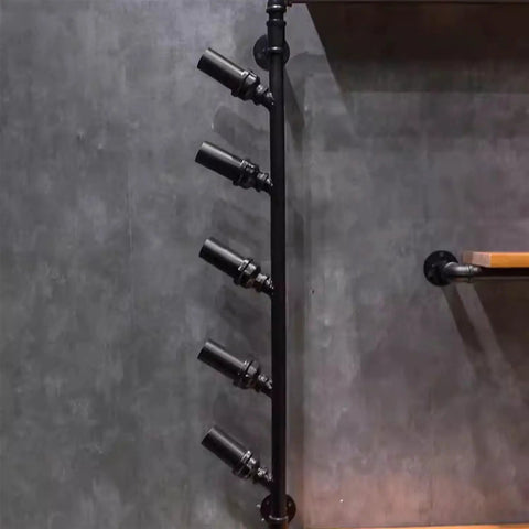 Straight Up Industrial Wine Rack Built From Heavy Duty Iron Pipes Countertop Or Wall Mount Organizer showcasing five bottle holders on a wall.