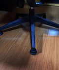 Heavy Duty Bell Glides Replace Office Desk Chair Casters, 5 Pack Black Stationary Feet on a hardwood floor.