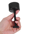 Hand holding a black plastic T handle socket from the 6 Piece Plastic T Handle Socket Wrench Set For Lamp Holder Ring Removal And Light Fixture Repair.