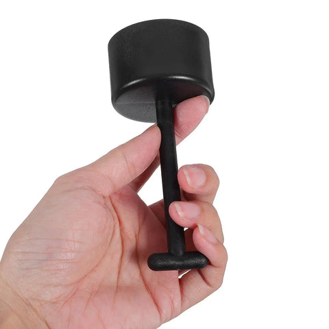 Hand holding a black plastic T handle socket from the 6 Piece Plastic T Handle Socket Wrench Set For Lamp Holder Ring Removal And Light Fixture Repair.