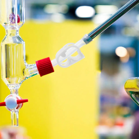 White Adjustable Plastic Tube Flow Control Clamps For Lab And Home Brew Pinch Valves For One Quarter Inch And Five Sixteenth Inch Tubing Regulate Or Stop Water Flow In Five To Eight Millimeter Lines 20 Pack attached to glass tubing.