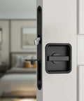 Pocket Door Lock Hardware Set With Privacy Handle And Hidden Pull Recessed Latch installed on a door in square black finish