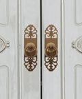 Vintage Brass Pull Handle 3cm by 12cm Cabinet Drawer Knob for Kitchen Wardrobe Door Furniture Replacement Hardware, Classic Retro Style, Easy Install Now mounted on a white cabinet door showing intricate design.