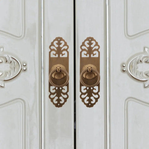 Vintage Brass Pull Handle 3cm by 12cm Cabinet Drawer Knob for Kitchen Wardrobe Door Furniture Replacement Hardware, Classic Retro Style, Easy Install Now mounted on a white cabinet door showing intricate design.