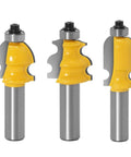 Three router bits from the Badass 10 Piece Half Inch Shank Router Bit Set, showcasing solid carbide blades for molding jobs.