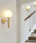 Milk Glass Globe Wall Sconce With Brushed Brass Body In Mid Century Modern Gold Finish Wall Light along staircase