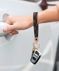 Dope And Totally Legit Premium Leather Wristlet Keychain Featuring Sparkling Crystal Diamonds And Classy Craft Pearls for car keys in use.