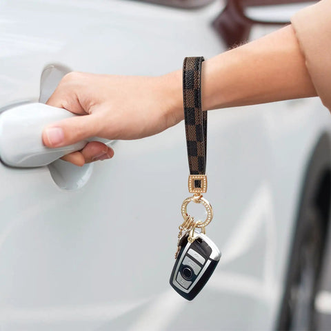 Dope And Totally Legit Premium Leather Wristlet Keychain Featuring Sparkling Crystal Diamonds And Classy Craft Pearls for car keys in use.