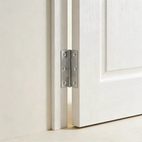 60 Pack Stainless Steel Cabinet Hinges Measuring Two Point Five Inches, Rock Solid Butt Hinges For Drawers Furniture Doors And Workshop Shelving, Silver Shine Pro Grade installed on a white cabinet door.