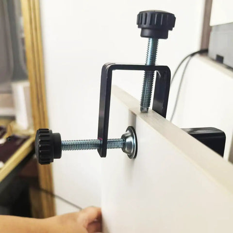 Close-up of 2-Pack Adjustable Drawer Front Mounting Clips And Clamps For Cabinet Hardware Jig attached to a drawer front.