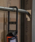 Go To Rechargeable LED Work Light with Kickstand and Carabiner hanging from metal pipe