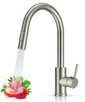 Rock Solid Kitchen Faucet With Smooth Pull Down Sprayer In Clean Brushed Nickel Finish displaying water spraying over fresh strawberries.