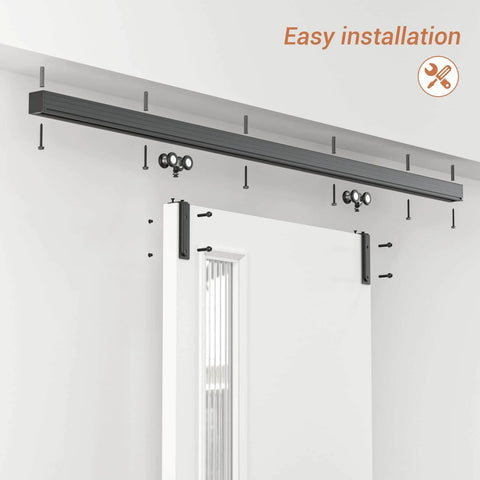 60 Inch Box Rail Sliding Barn Door Hardware Kit With Ceiling Mount Heavy Duty Aluminum Track In Black Powder Coat Outdoor Ready And Anti Corrosion Fits Doors Up To 26 Inch Opening Up To 30 Inch Panel Width 1 Inch Door Thickness, shown installed on a white wall with a door.