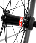 Close-up of hub on Dope Carbon Road Bike Disc Brake Wheelset With 55mm Clincher Tubeless Ready Rim 25mm Width UD Matte Finish 700C QR