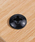 Pro Grade Phillips Pan Head Self Tapping Screws, Black Coated 304 Stainless Steel Tek Fasteners on wood surface.