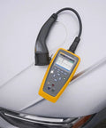 Heavy Duty Electric Vehicle Charging Station Analyzer With Type 1 Plug For Knockout AC Diagnostic Testing on white car hood.