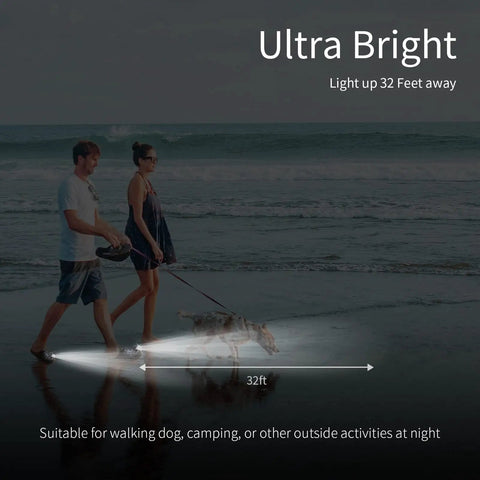 Couple walking dog on beach at night using Two Pack Rechargeable LED Headlamps Waterproof Hands Free Flashlights.